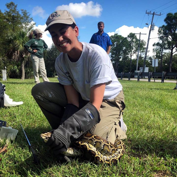 Valeria taking a python catching training through FWC.